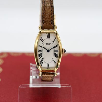 Los Nr. 120 Damenarmbanduhr und Klappschließe, Cartier, Modell Tonneau, Paris, 90er Jahre